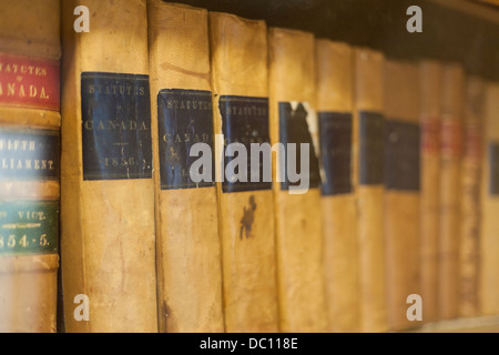 Old Statutes of Canada books from 1856. Law books from 1856, on a dusty bookshelf. Pinhey's Point, Ottawa, Ontario, Canada Stock Photo