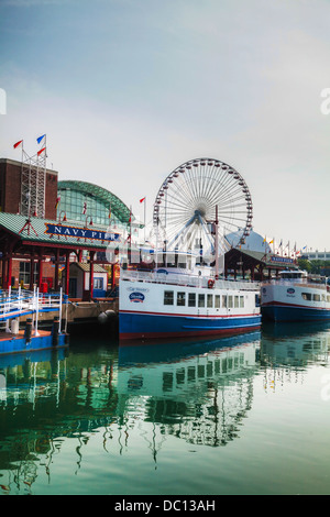 Navy Pier on May 19, 2013 in Chicago, IL. It's is a 3,300-foot (1,010 m) long pier on the Chicago shoreline of Lake Michigan. Stock Photo