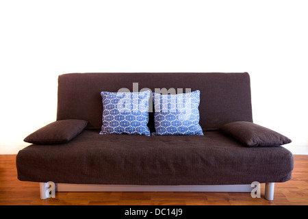 interior of studio, black couch with pillows isolated on white Stock Photo