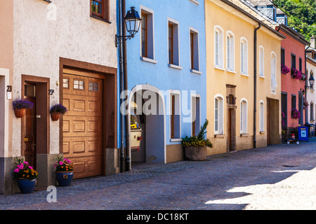 Colourful houses in a narrow cobbled sidestreet in the picturesque village of Vianden in Luxembourg. Stock Photo