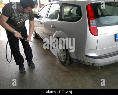 Man washing car Stock Photo