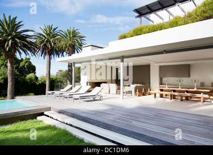 Lounge chairs on deck of modern house Stock Photo