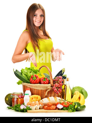 Young woman with variety of grocery products isolated on white Stock Photo