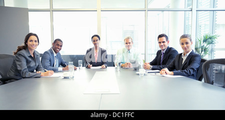 Portrait of confident business people at table in conference room Stock Photo