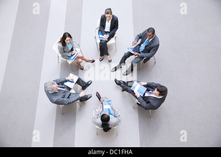 High angle view of business people sitting in circle Stock Photo