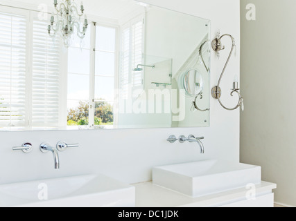 Sinks and mirror in modern bathroom Stock Photo