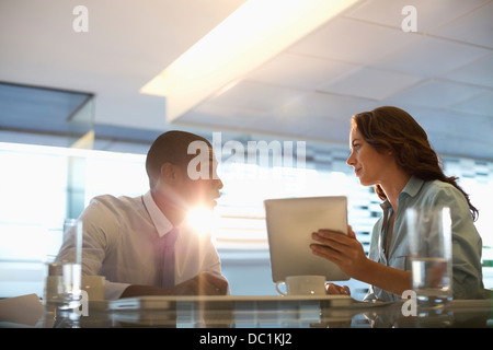 Businessman and businesswoman using digital tablet Stock Photo