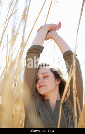 Portrait of young woman amongst reeds Stock Photo