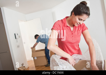 Young couple moving and unpacking Stock Photo
