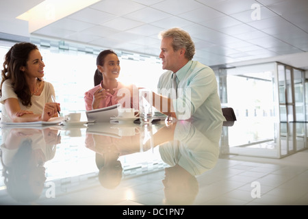 Business people talking in lobby Stock Photo