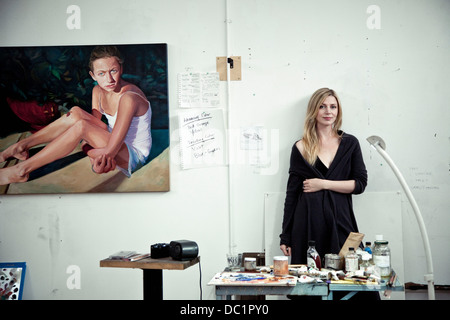 Mid adult woman standing in artist's studio, portrait Stock Photo