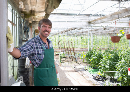 Portrait of organic farmer in greenhouse Stock Photo