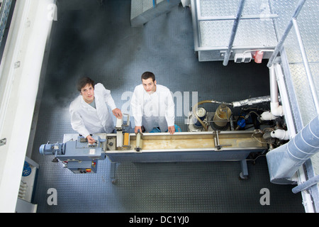 Elevated view of two technicians in working laboratory Stock Photo