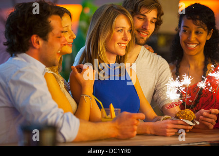 Group of friends with cocktails in bar Stock Photo
