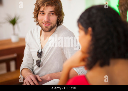 Young couple talking in cafe Stock Photo
