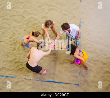 Aerial view of friends team talk at indoor beach volleyball Stock Photo