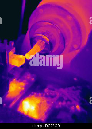 Thermal image of part being turned on lathe, with heating of the cutting tool, part and shavings Stock Photo