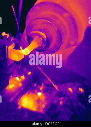 Thermal image of part being turned on lathe, with heating of the cutting tool, part and shavings Stock Photo