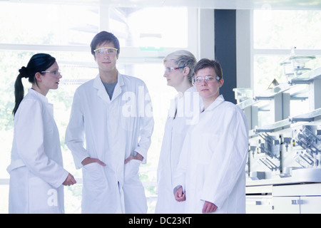 Chemistry students standing together in laboratory, portrait Stock Photo