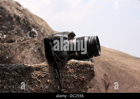 Canon EOS 550D or Rebel T2i  camera placed on a rock Stock Photo