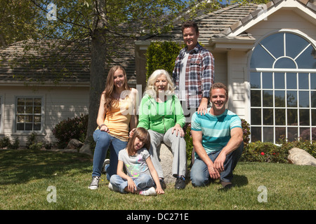 Portrait of three generation family in garden Stock Photo