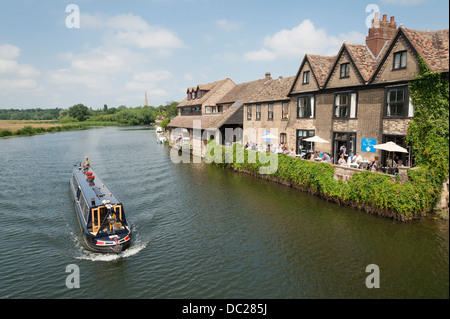 A narrowboat or longboat on the River Great Ouse St Ives Cambridgeshire UK on a sunny summer day Stock Photo