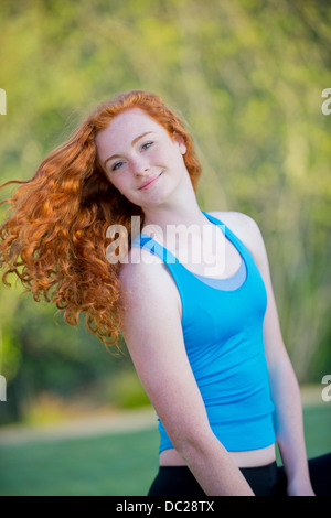 portrait of teenage girl with long red hair