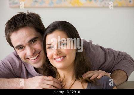 Portrait of couple, man with hand on woman's shoulder Stock Photo