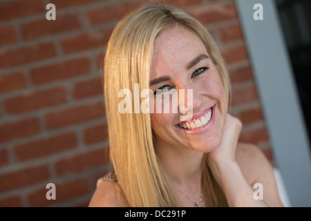 Portrait of young blonde woman smiling Stock Photo