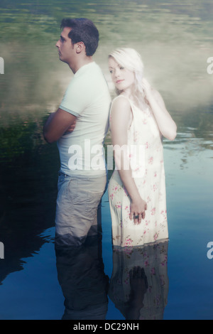 a couple in water, having a conflict Stock Photo