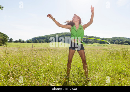 Young woman with plastic hoop Stock Photo