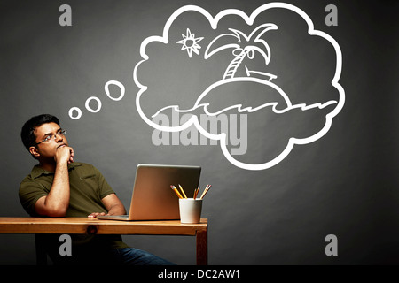 Man dreaming of island in the sun Stock Photo
