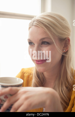 Woman holding tea cup Stock Photo