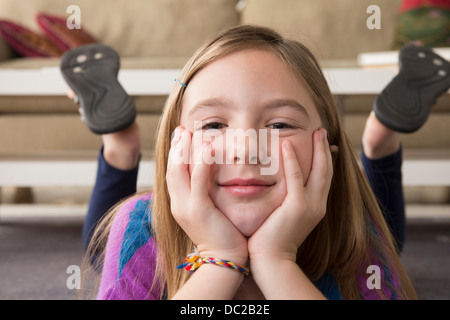 Girl lying on stomach Stock Photo - Alamy