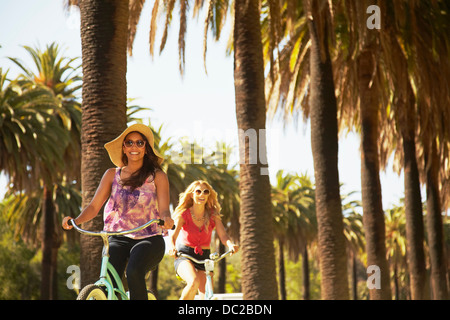 Women on bicycle laughing Stock Photo
