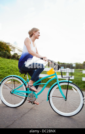 Woman riding bicycle Stock Photo
