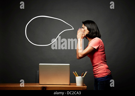 Woman shouting empty speech bubble Stock Photo