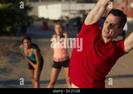 People doing stretching exercise Stock Photo