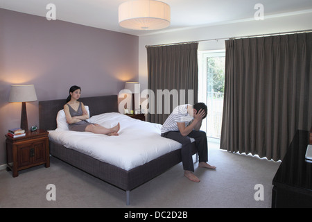 Couple arguing in bedroom Stock Photo