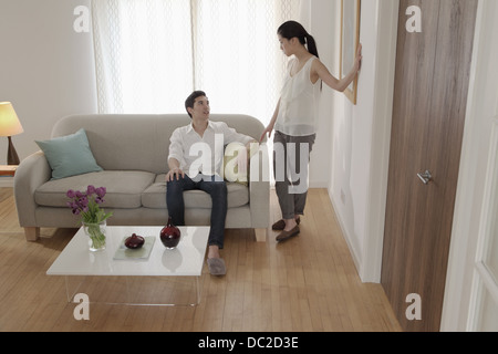 Couple discussing in living room Stock Photo