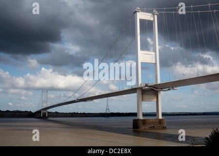 Old Severn Bridge in dramatic light with stormy sky Near Chepstow South Wales UK Stock Photo