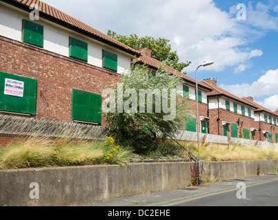 Row of boarded up houses a Swainby near Stockton on Tees, north east England, UK Stock Photo