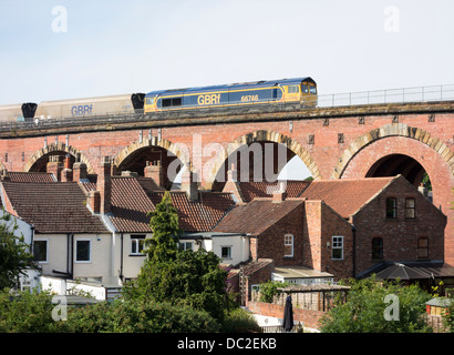 Coal freight train crossing viaduct over the river Tees at Yarm near Stockton on Tees, north east England, UK Stock Photo