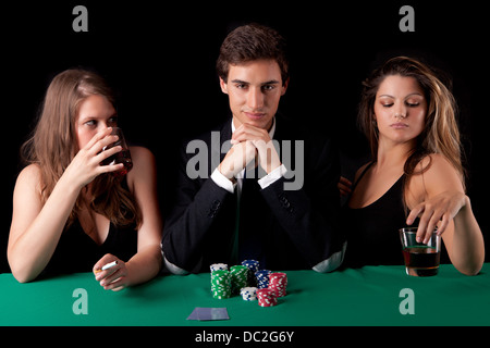 Young handsome man playing texas hold'em poker Stock Photo