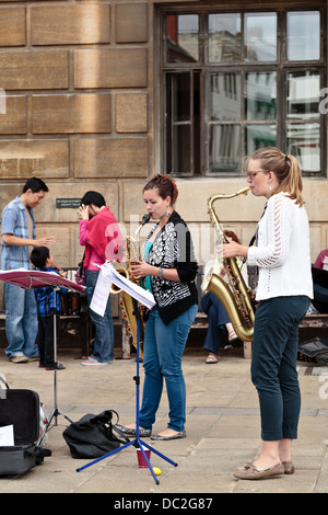 Saxual Healing quartet street performers at market square in Cambridge ...