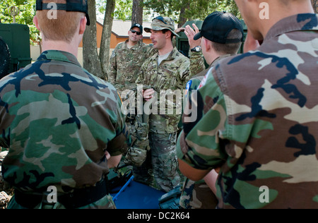 Cadets from the Michigan Wing Civil Air Patrol listen to Joint Tactical Air Controller Senior Airman Stephen Gartlan from the 182nd Air Support Operations Group talk about his career field near a Humvee at Alpena Combat Readiness Training Center, Mich., A Stock Photo