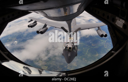 A B-52 Stratofortress from the 307th Bomb Wing, Barksdale Air Force Base, La., prepares to take on a fuel load from a KC-135 Stratotanker flown by the 18th Air Refueling Squadron, Air Force Reserve Command, McConnell AFB, Kan., Aug. 3, 2013, over Arkansas Stock Photo