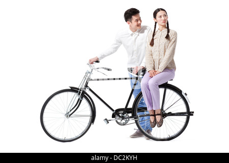 Retro couple with an old-fashioned bicycle Stock Photo