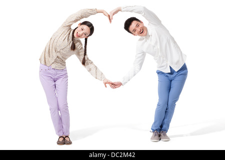 Retro image of couple making heart shape with hands in park Stock Photo ...