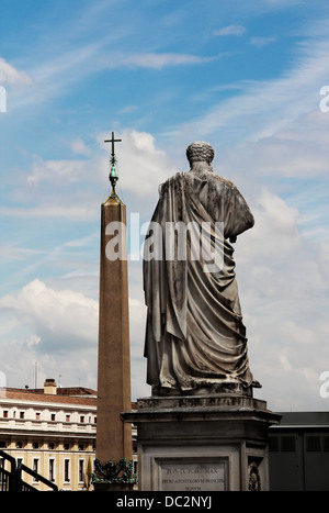 Statue of Saint Peter and obelisk on Saint Peter's square, back view, in Vatican city, Italy Stock Photo